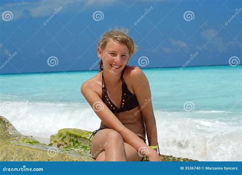 Smiling Teenage Girl Sitting In Beach Chair Grand Cayman Relaxation Water Stock Photo