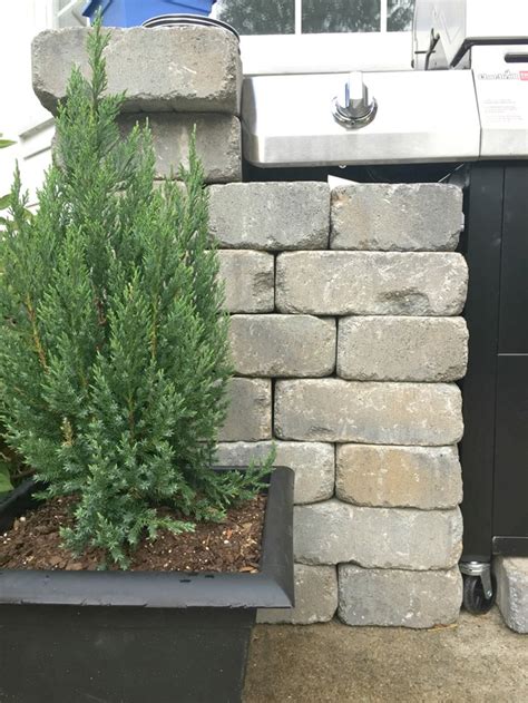 Include stones in your outdoor kitchen ideas. How To Create a DIY Outdoor "Kitchen" - Emily A. Clark