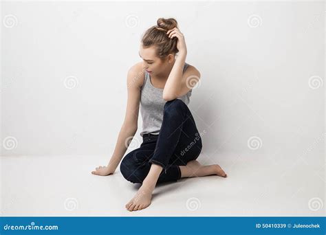beautiful melancholic girl sitting on the floor stock image image of adult freshness 50410339