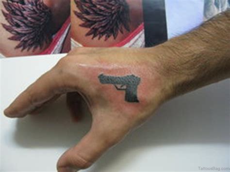 28 Funky Gun Tattoos On Hand