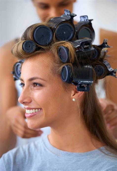 How To Use Hot Rollers Model With Rollers In Her Hair With Stylist