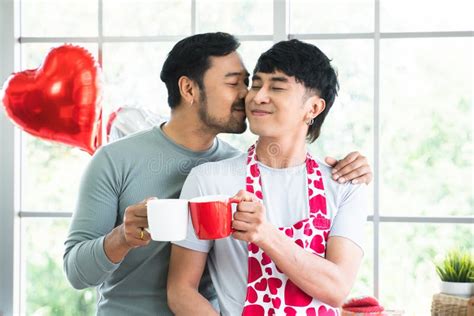 Lgbtq Gay Couple Handsome Men Kissing In Morning In Kitchen At Home While Have Breakfast
