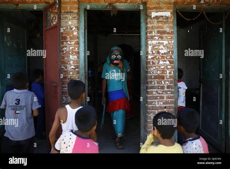 lalitpur nepal 13th aug 2016 a nepalese person dressed in a lakhey costume heading out from