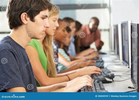 Group Of Students Working At Computers In Classroom Royalty Free Stock