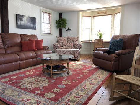 What size rug for a couch? Tribal red rug, family room, brown leather sofa, pine ...