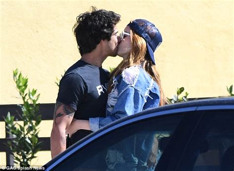 bella thorne and tyler posey pack on pda as they share kiss on the street in la after he