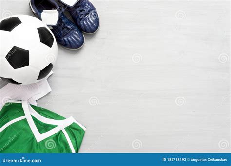 Soccer Equipment On Grey Wooden Background Kids Sport Concept Stock