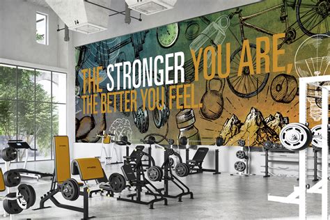 There Is A Gym With An Advertisement On The Wall And Various Exercise