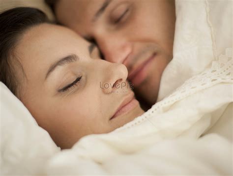 Husband And Wife Sleeping Together