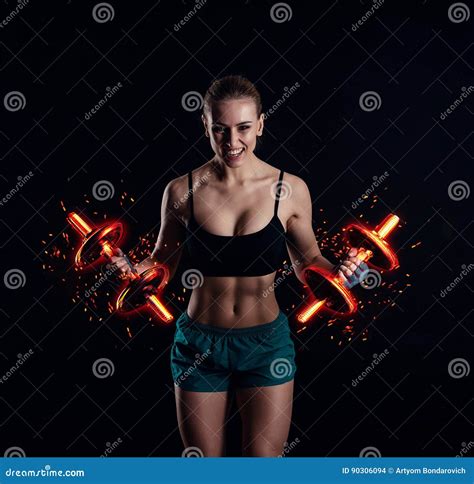 Portrait Of A Young Fitness Woman In Sportswear Doing Workout With