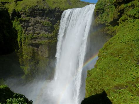 Fotos gratis paisaje naturaleza cascada rápido Islandia Cuerpo de agua Skogafoss arco
