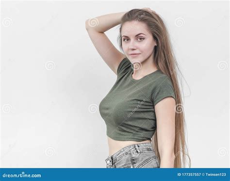 nice girl with beautiful breasts in a green t shirt posing on ca stock image image of blank