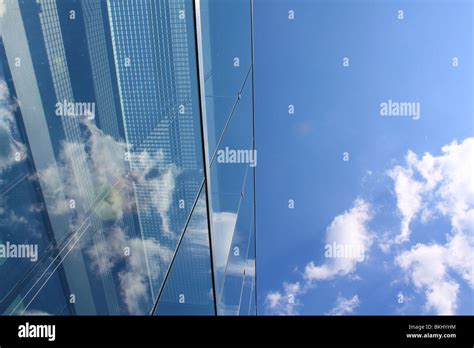 Modern Glass Office Building Reflecting The Clouds Stock Photo Alamy