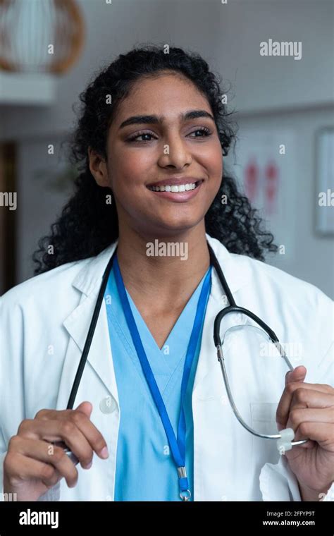 Portrait Of Smiling Mixed Race Female Doctor With Stethoscope Wearing