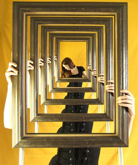 a woman holding up several frames in front of her face