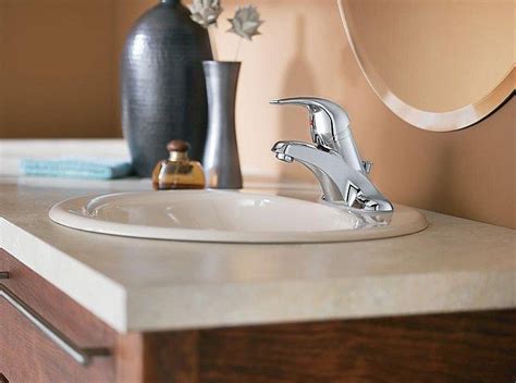 Bathroom faucets come in dozens of finishes like chrome, brushed nickel, stainless steel and even brass. Installing a New Bathroom Faucet in a New Vanity Top