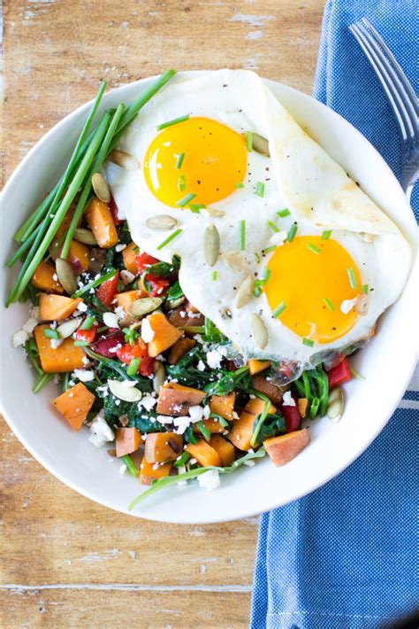 Breakfast Bowl With Sweet Potato Greens And Fried Eggs