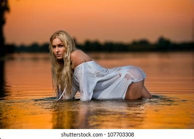 Sexy Blonde Woman Water Sunset Beautiful Stock Photo