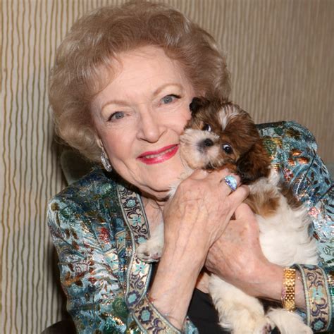 23 Pictures Of Betty White With Puppies To Brighten Your Day