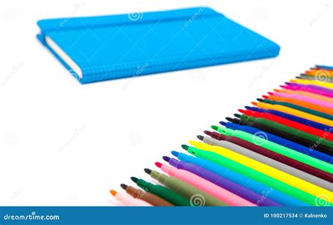 Notebook And Multicolored Markers On A White Background Stock Photo