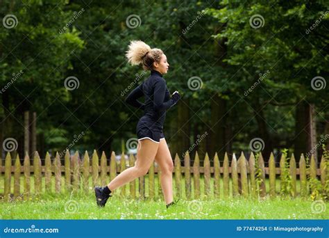 Side Portrait Of Young Female Runner Outside Stock Photo Image Of