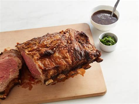 Prime rib, also referred to as standing rib roast, is a beautiful piece of meat. Prime Rib with Red Wine-Thyme Butter Sauce Recipe | Bobby Flay | Food Network
