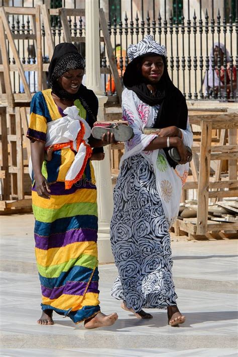 Unidentified Senegalese Women In Colored Traditional Clothes Wa