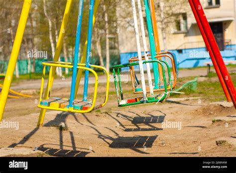 Empty Playground And Swings In Colorful Park Russia Stock Photo Alamy