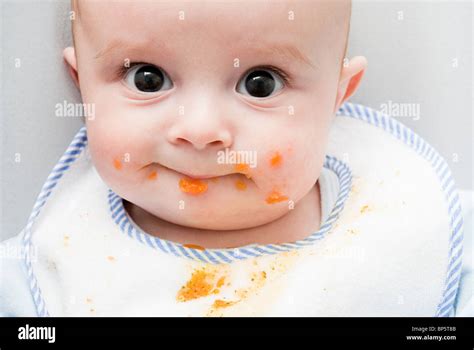 Baby With Food On His Face Stock Photo Alamy
