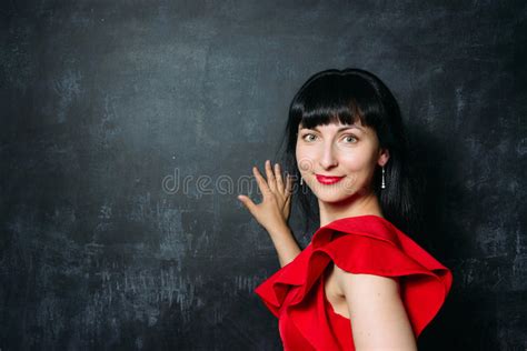 Beautiful Young Model Woman Red Dress Posing Over Black Slate Stock