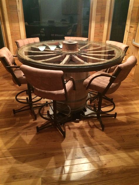 After i made my lounge sofa i needed a new fitting lounge/coffee table. Wagon wheel dining table | Wagon wheel decor, Wagon wheel ...