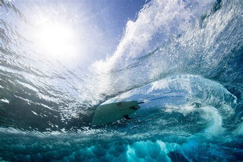 Photographer Captures Stunning Underwater Photos Beneath Breaking Waves