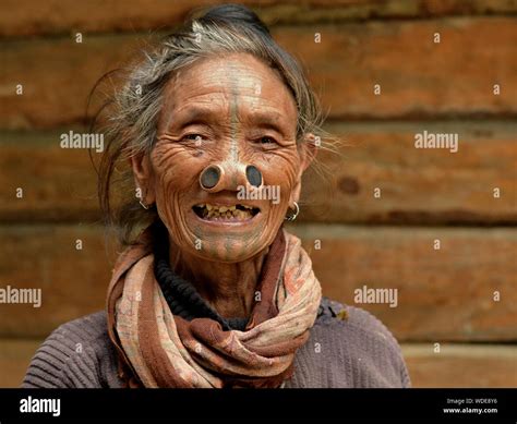 Old Indian Apatani Tribal Woman With Black Wooden Nose Plugs Yawping