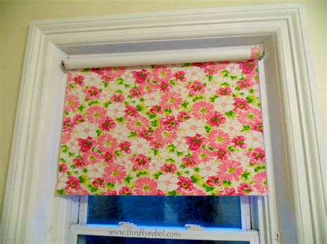 Window treatments are a quick and simple way to add interest to a room's decor. DIY Fabric Covered Vinyl Roller Shade - Thrifty Rebel Vintage