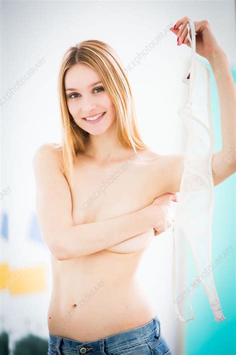 Woman Removing Her Bra Stock Image C Science Photo Library