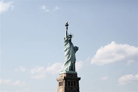 The landmark statue of liberty against the impressive new york city skyline. Statue Of Liberty - Free Stock Photos | Life of Pix
