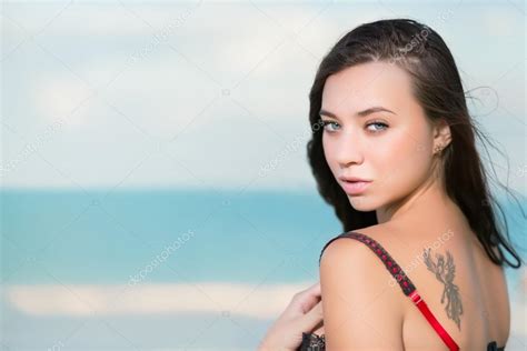 Sexy Brunette Posing On The Beach Stock Photo By Acidgrey 49263395