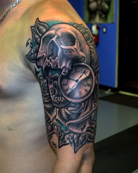 Grey Ink Compass And Skull Tattoo On Left Half Sleeve