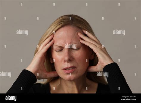 Attractive Middle Aged Woman Suffering From Migraine Headache Usa
