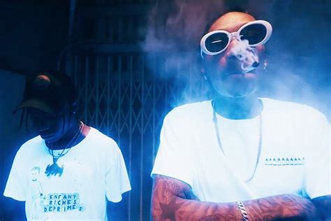 Wiz Khalifa And Travis Scott Are Waking And Baking In Fluorescent Bake Sale Video