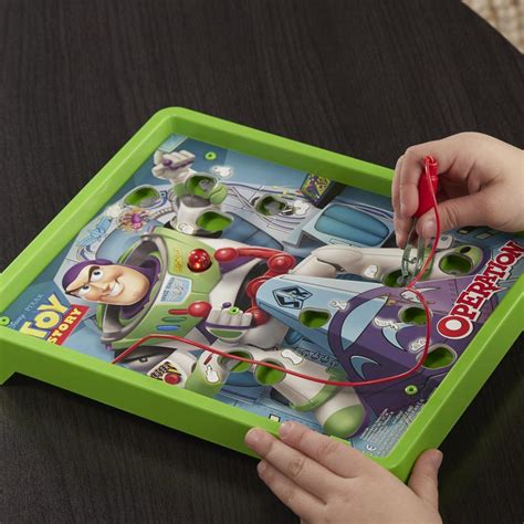 A drinking game using a mug with cards spread in a circle around it. Hasbro Games Toy Story Buzz Lightyear Edition Operation ...