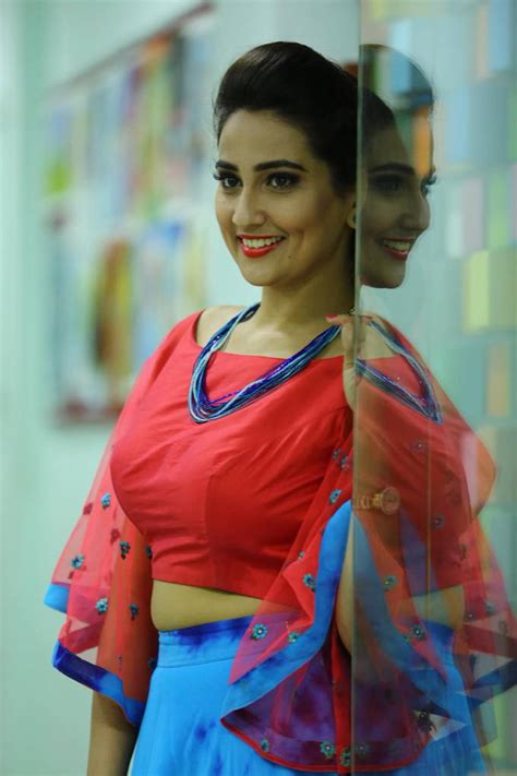 tv anchor manjusha photo shoot in blue lehenga red choli tolly boost