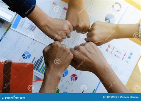 Close Up Top View Of Young Business People Take Fist Bump To Sign Of