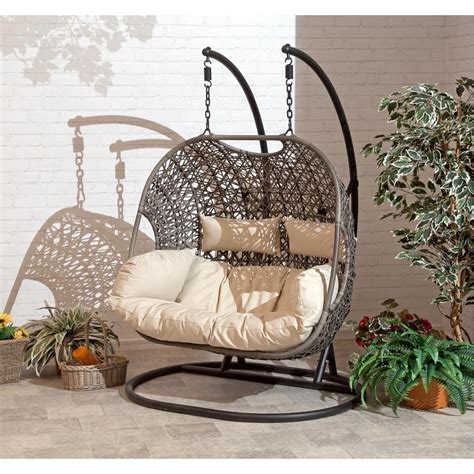 suntime outdoor living brampton 53 5 in 2 person brown metal patio swing with beige cushions