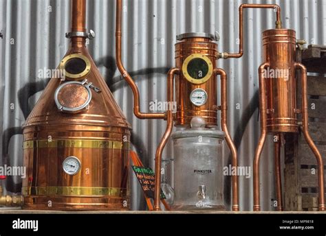 A Still Or Distillery Equipment Made From Copper At A Gin Manufacturer