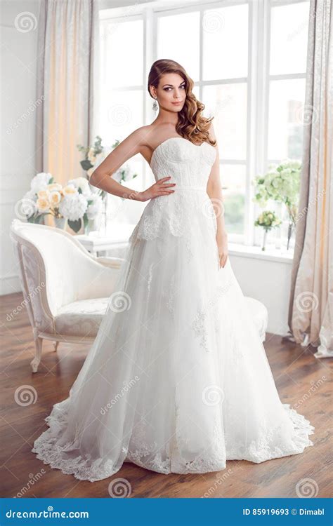 Beautiful Bride In Gorgeous Wedding Dress Indoors Wedding Fashion