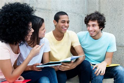 Caucasian And African And Latin Students Learning Together Stock Image