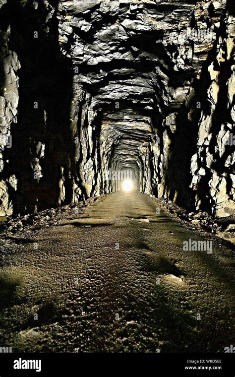 Dirt Road In Rocky Tunnel Stock Photo Alamy
