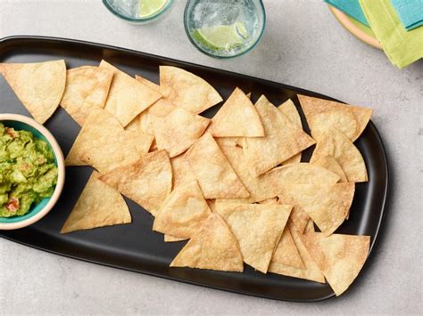 Preheat the oven and bake tortillas for 5 minutes at 390ºf or 200ºc in the middle rack of your oven. Baked Tortilla Chips Recipe | Food Network Kitchen | Food ...