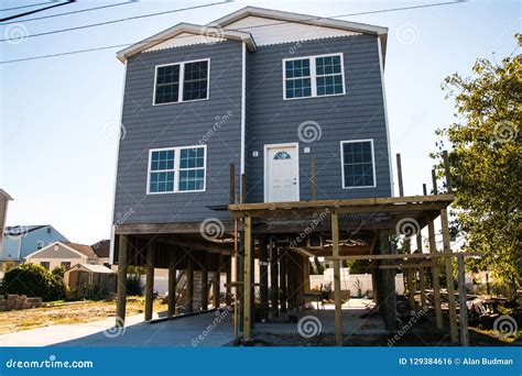 House Being Raised And Put On Stilts To Avoid Flooding In This New